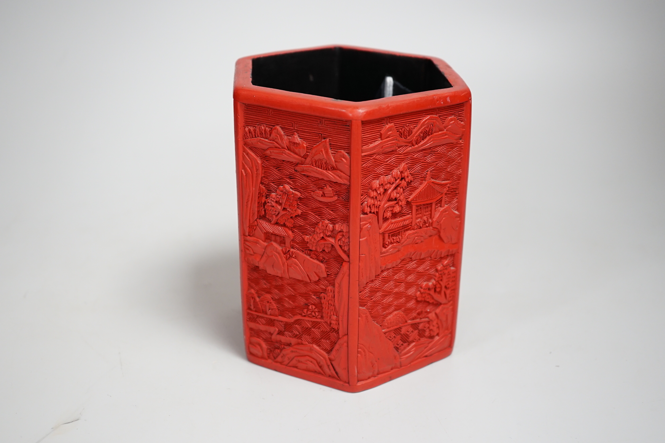 A Chinese cinnabar lacquer hexagonal brushpot, 14.5cm high
